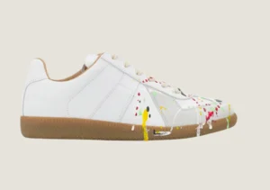 MM Dirty Wash nubuck leather and velour featuring a paint splatter design.