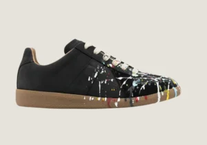 MM nubuck leather and velour featuring a paint splatter design.